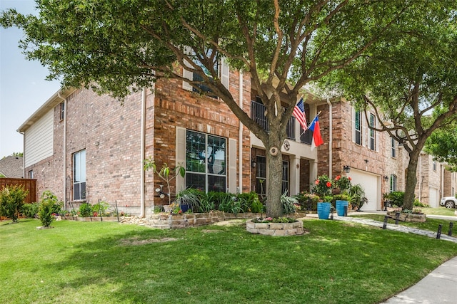 10228 Crawford Farms Dr, Fort Worth, TX 76244 - view of front of property with brick siding, a front yard, and a garage