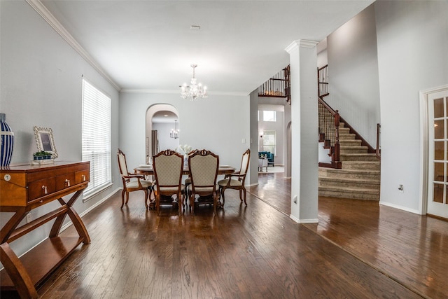 10228 Crawford Farms Dr, Fort Worth, TX 76244 - dining room with ornamental molding, wood-type flooring, a chandelier, arched walkways, and baseboards