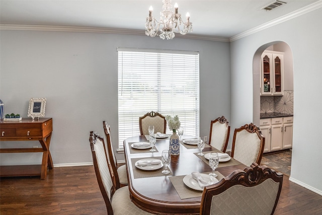10228 Crawford Farms Dr, Fort Worth, TX 76244 - dining space featuring plenty of natural light, dark wood-type flooring, a chandelier, arched walkways, and ornamental molding