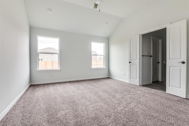 3510 Middlefield Rd, Dallas, TX 75253 - unfurnished bedroom featuring carpet flooring, lofted ceiling, and baseboards