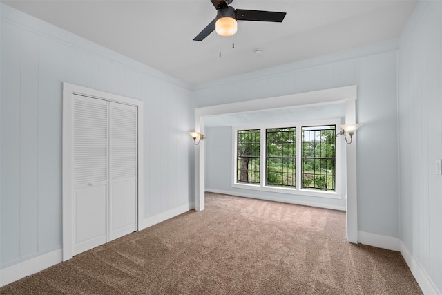 2124 21st St, Fort Worth, TX 76164 - unfurnished bedroom featuring carpet floors, a closet, baseboards, and ceiling fan
