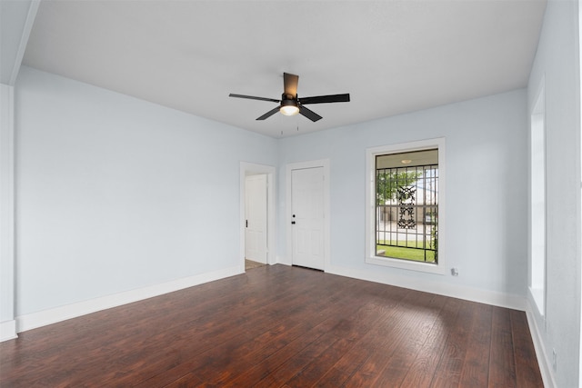 2124 21st St, Fort Worth, TX 76164 - spare room featuring dark wood-style flooring, ceiling fan, and baseboards