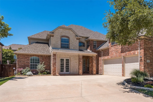 708 Renaissance Ct, Keller, TX 76248 - french country style house with roof with shingles, fence, french doors, concrete driveway, and a garage