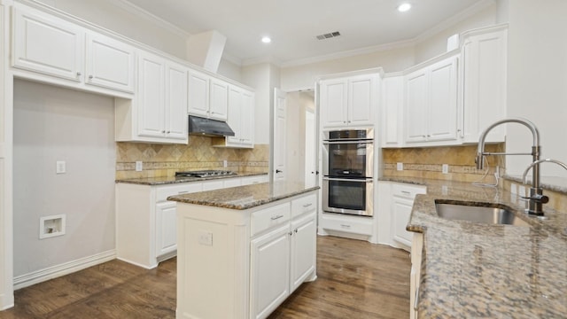 708 Renaissance Ct, Keller, TX 76248 - kitchen with a center island, a sink, stainless steel appliances, under cabinet range hood, and recessed lighting