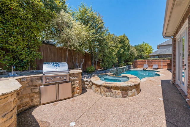 708 Renaissance Ct, Keller, TX 76248 - view of pool with exterior kitchen, a patio, a sink, grilling area, and a fenced backyard
