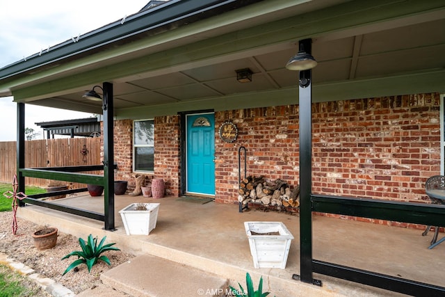 3756 County Road 192, Anson, TX 79501 - view of patio / terrace with covered porch and fence
