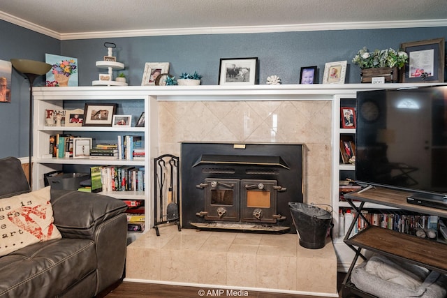 3756 County Road 192, Anson, TX 79501 - living room featuring a textured ceiling, ornamental molding, wood finished floors, and a fireplace
