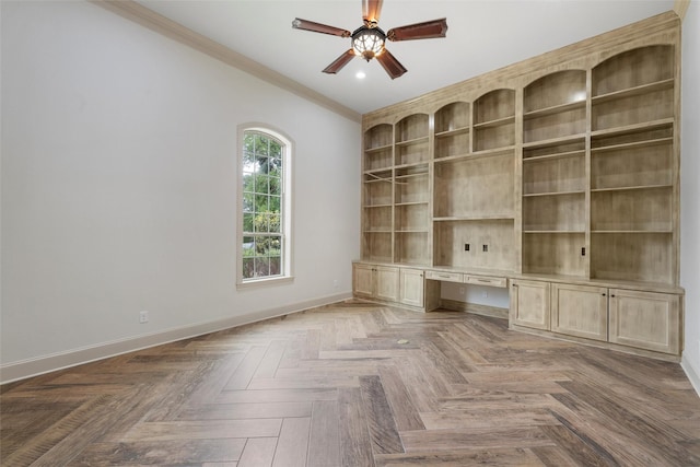 unfurnished office with ornamental molding, baseboards, recessed lighting, built in desk, and a ceiling fan