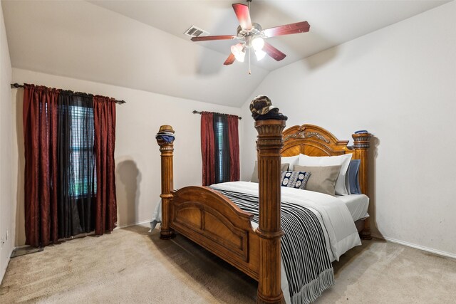 carpeted bedroom with lofted ceiling, baseboards, and a ceiling fan