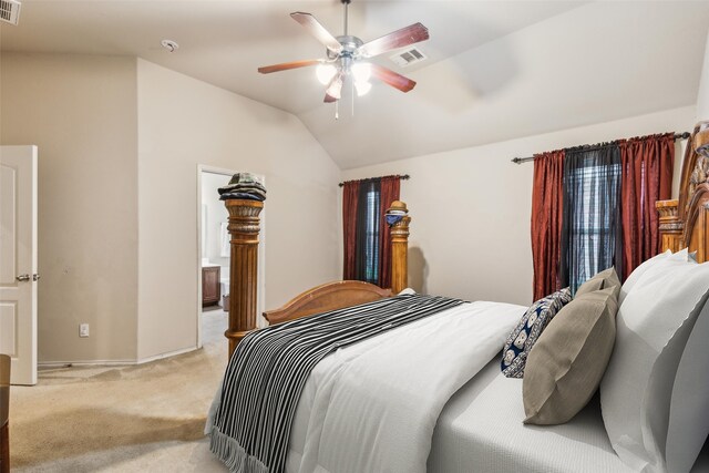 bedroom featuring light carpet, vaulted ceiling, a ceiling fan, connected bathroom, and baseboards