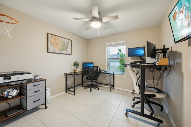 office featuring baseboards and ceiling fan