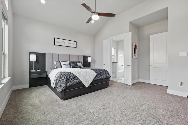 bedroom featuring baseboards, a ceiling fan, carpet, and ensuite bath