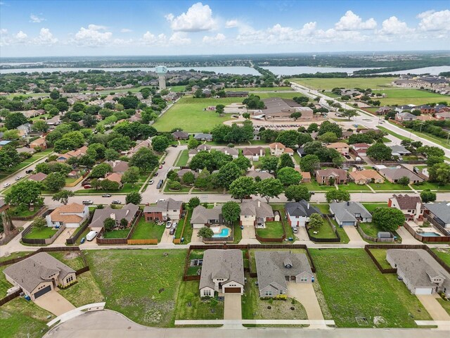 drone / aerial view with a water view and a residential view