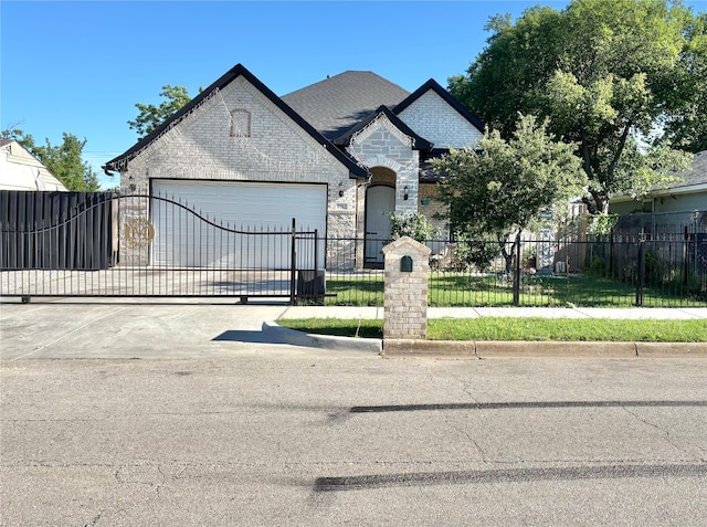 2512 Highcrest Ave, Fort Worth, TX 76111 - french provincial home with a garage, a fenced front yard, concrete driveway, and brick siding