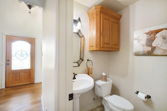 540A Southerland Ln, Weatherford, TX 76088 - bathroom featuring a sink, toilet, and wood finished floors