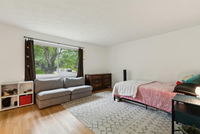 bedroom featuring wood finished floors