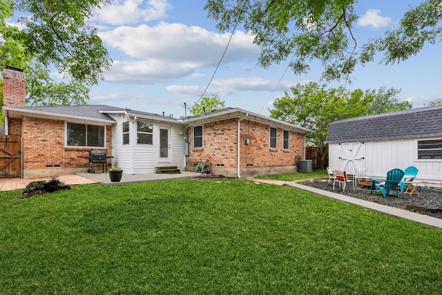 8545 Sweetwater Dr, Dallas, TX 75228 - rear view of property featuring brick siding, central AC, a chimney, and entry steps