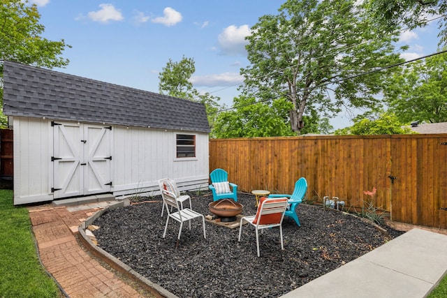 8545 Sweetwater Dr, Dallas, TX 75228 - fenced backyard with an outdoor structure, a storage unit, and an outdoor fire pit