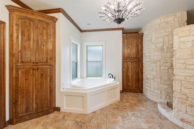 full bath with a garden tub, ornamental molding, stone finish flooring, and a chandelier