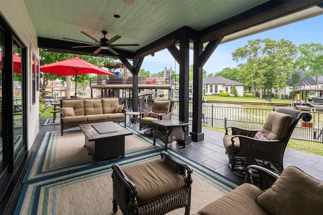 view of patio featuring an outdoor living space and ceiling fan