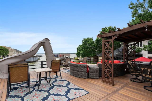 wooden terrace with outdoor dining space