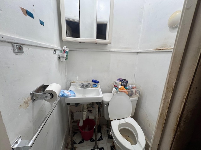 bathroom featuring tile patterned flooring and toilet