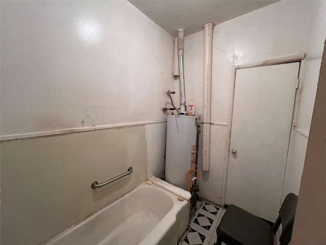 bathroom with a bathtub and gas water heater