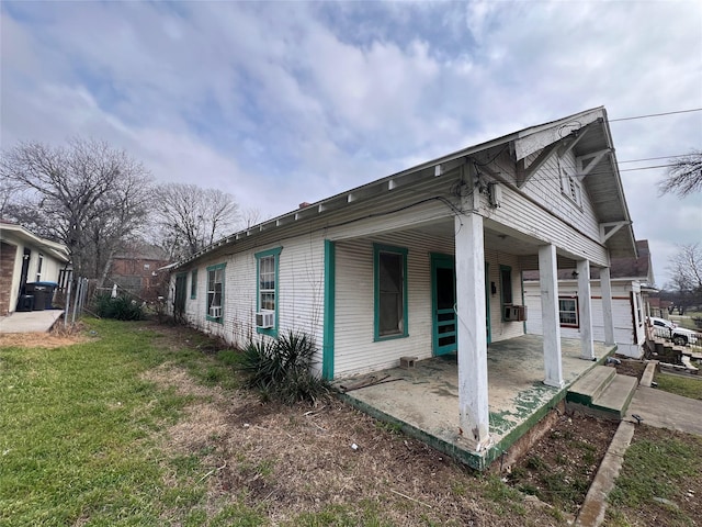 view of home's exterior featuring a yard and cooling unit