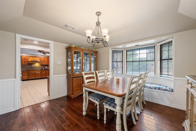 dining space with visible vents, wainscoting, and hardwood / wood-style flooring