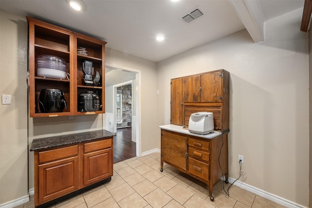 interior space featuring visible vents, recessed lighting, baseboards, and light tile patterned floors