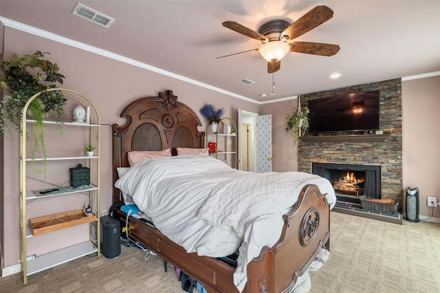 bedroom featuring a fireplace, ornamental molding, carpet, and visible vents