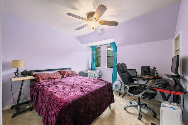 carpeted bedroom with baseboards, ceiling fan, and vaulted ceiling