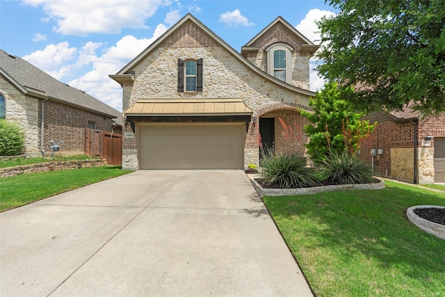 3608 Delta Dr, Mckinney, TX 75071 - french provincial home with stone siding, driveway, a standing seam roof, and a garage