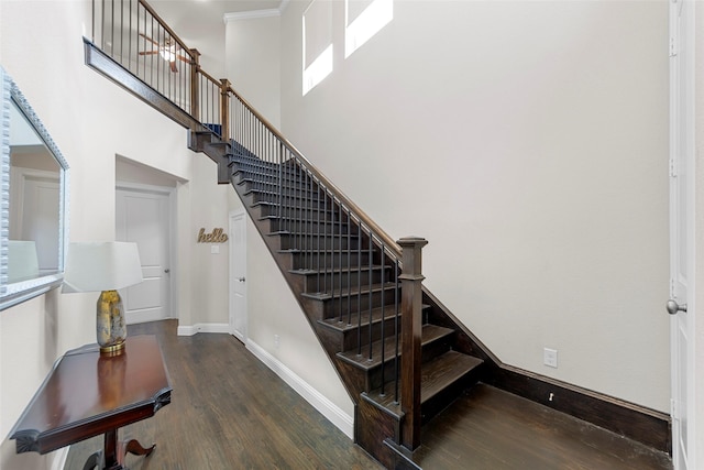 3608 Delta Dr, Mckinney, TX 75071 - staircase with wood finished floors, a towering ceiling, baseboards, and ornamental molding