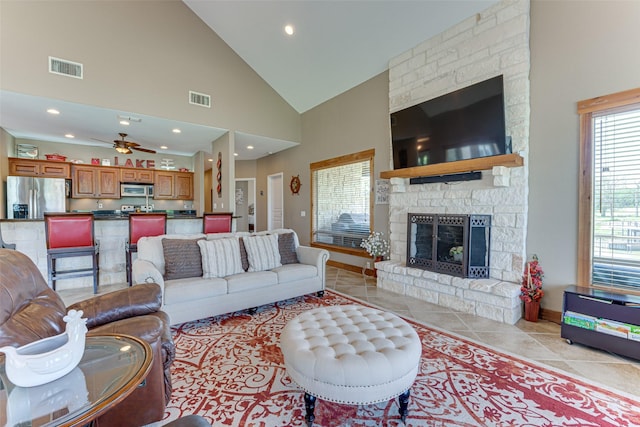 5553 Lakeshore Ct, Log Cabin, TX 75148 - living area with ceiling fan, visible vents, a fireplace, baseboards, and light tile patterned flooring