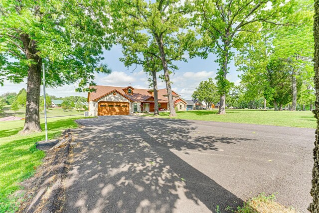 5553 Lakeshore Ct, Log Cabin, TX 75148 - view of front of property with a garage, a front yard, and aphalt driveway