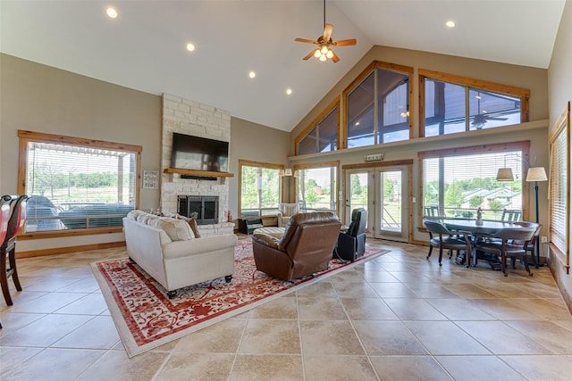 5553 Lakeshore Ct, Log Cabin, TX 75148 - living room with plenty of natural light, a ceiling fan, a stone fireplace, high vaulted ceiling, and recessed lighting