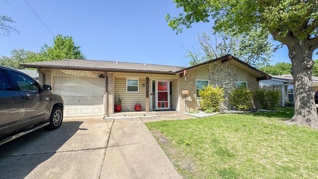 ranch-style house featuring brick siding, driveway, a front yard, and a garage