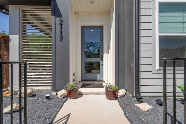 entrance to property featuring board and batten siding