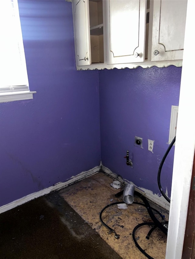 laundry area featuring electric dryer hookup and baseboards