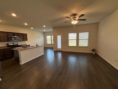 1109 Colonial Bluff Ln, Princeton, TX 75407 - kitchen featuring ceiling fan, dark wood finished floors, stainless steel appliances, open floor plan, and recessed lighting