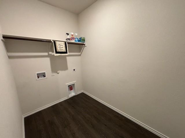 1109 Colonial Bluff Ln, Princeton, TX 75407 - clothes washing area with gas dryer hookup, washer hookup, laundry area, dark wood-style flooring, and electric dryer hookup
