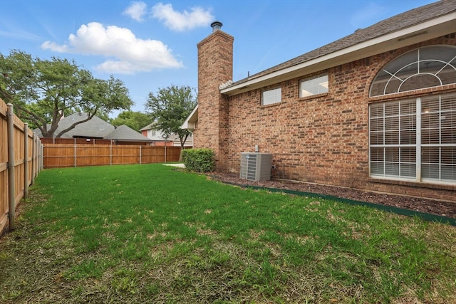 view of yard featuring cooling unit and a fenced backyard