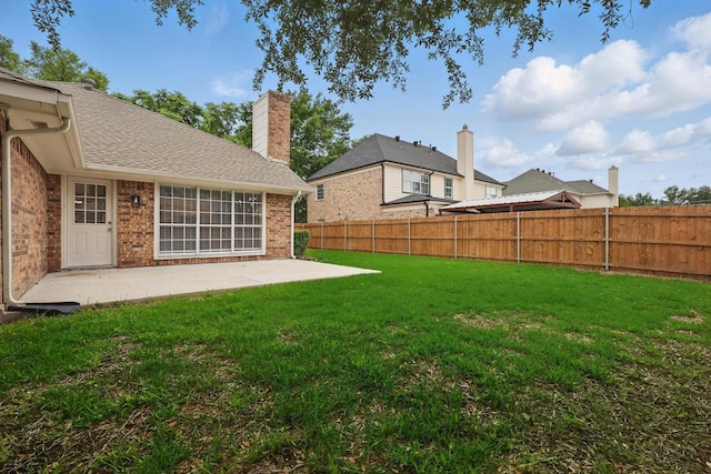 view of yard featuring a patio and a fenced backyard