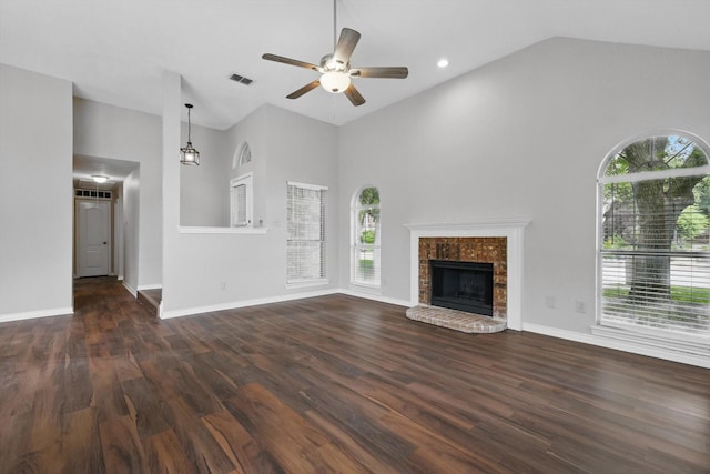 unfurnished living room featuring a ceiling fan, visible vents, and a wealth of natural light