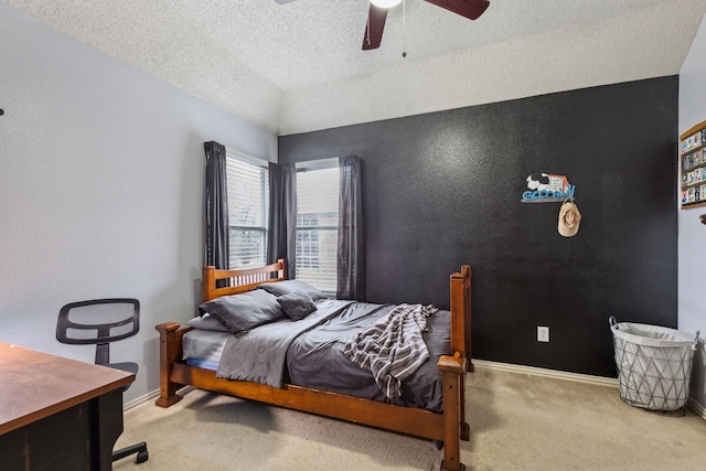 carpeted bedroom featuring baseboards, a textured ceiling, ceiling fan, and lofted ceiling