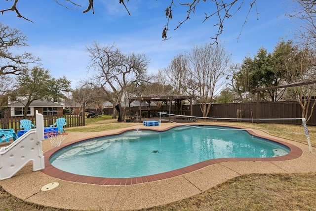 view of swimming pool with a fenced backyard, a fenced in pool, and a patio area