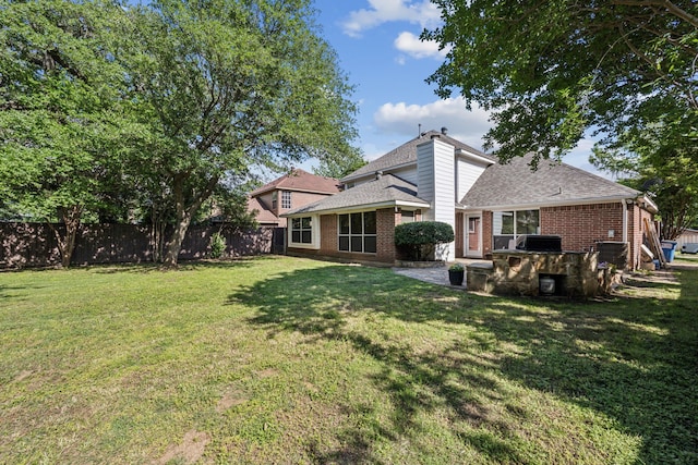 106 Hollywood Blvd, Euless, TX 76040 - rear view of house featuring brick siding, roof with shingles, and a patio