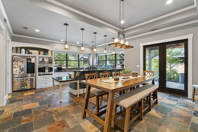 dining room with visible vents, stone tile floors, crown molding, and recessed lighting
