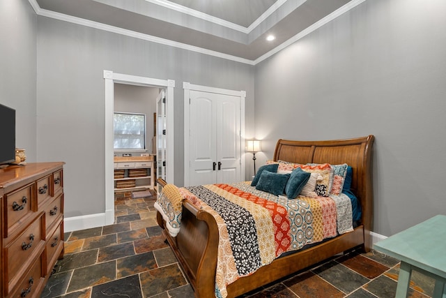 bedroom with baseboards, ornamental molding, a closet, and stone tile floors